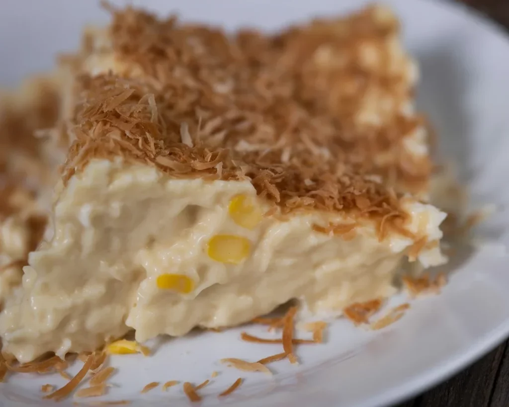 Delicious Filipino Maja Blanca coconut pudding topped with toasted coconut.