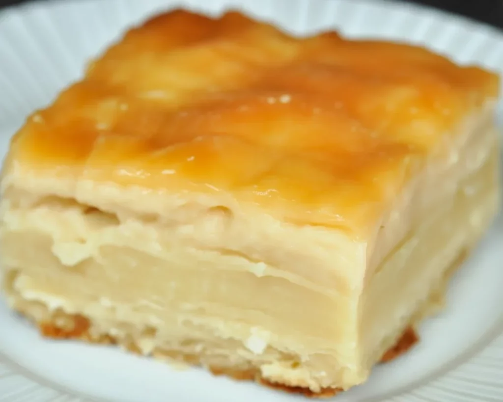 Delicious baked cassava cake with custard topping in the oven.
