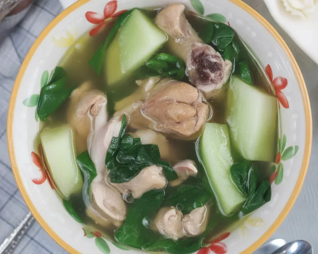 Delicious tinola with spinach, a Filipino chicken soup with ginger and fresh vegetables.