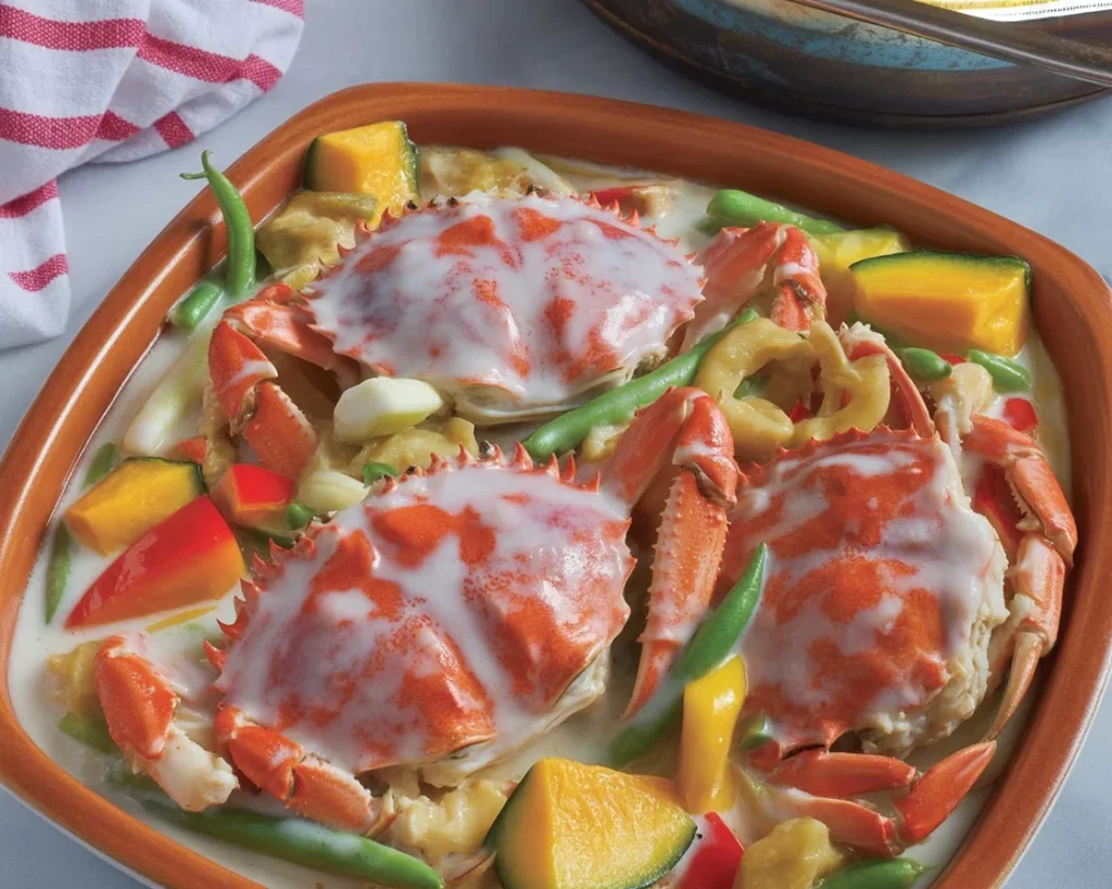 Delicious Filipino ginataang alimango dish with crabs cooked in creamy coconut milk.