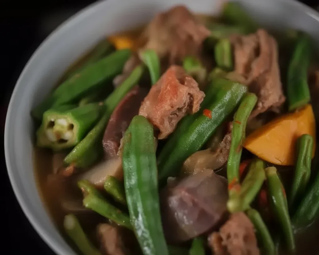 Filipino pinakbet Ilocano vegetable stew with pork, eggplant, and bitter melon.