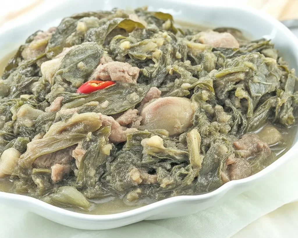 Filipino laing recipe featuring dried taro leaves and coconut milk.