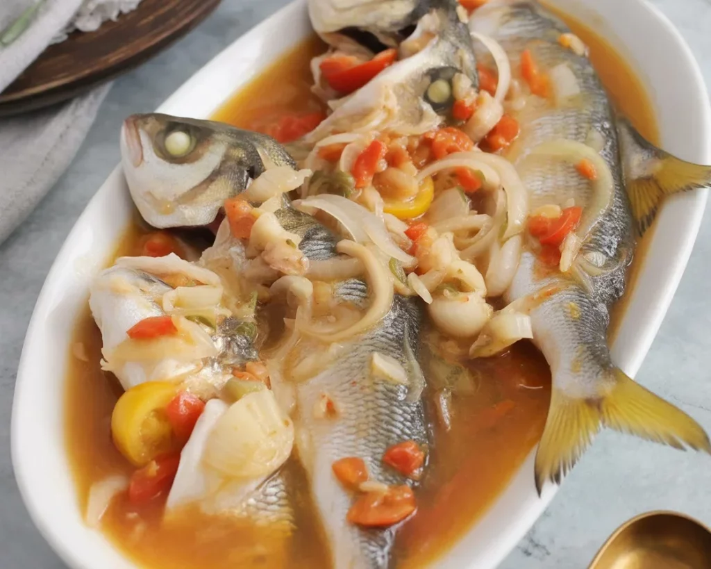 Pinangat na Isda - Traditional Filipino fish stew with tomatoes and sour broth.