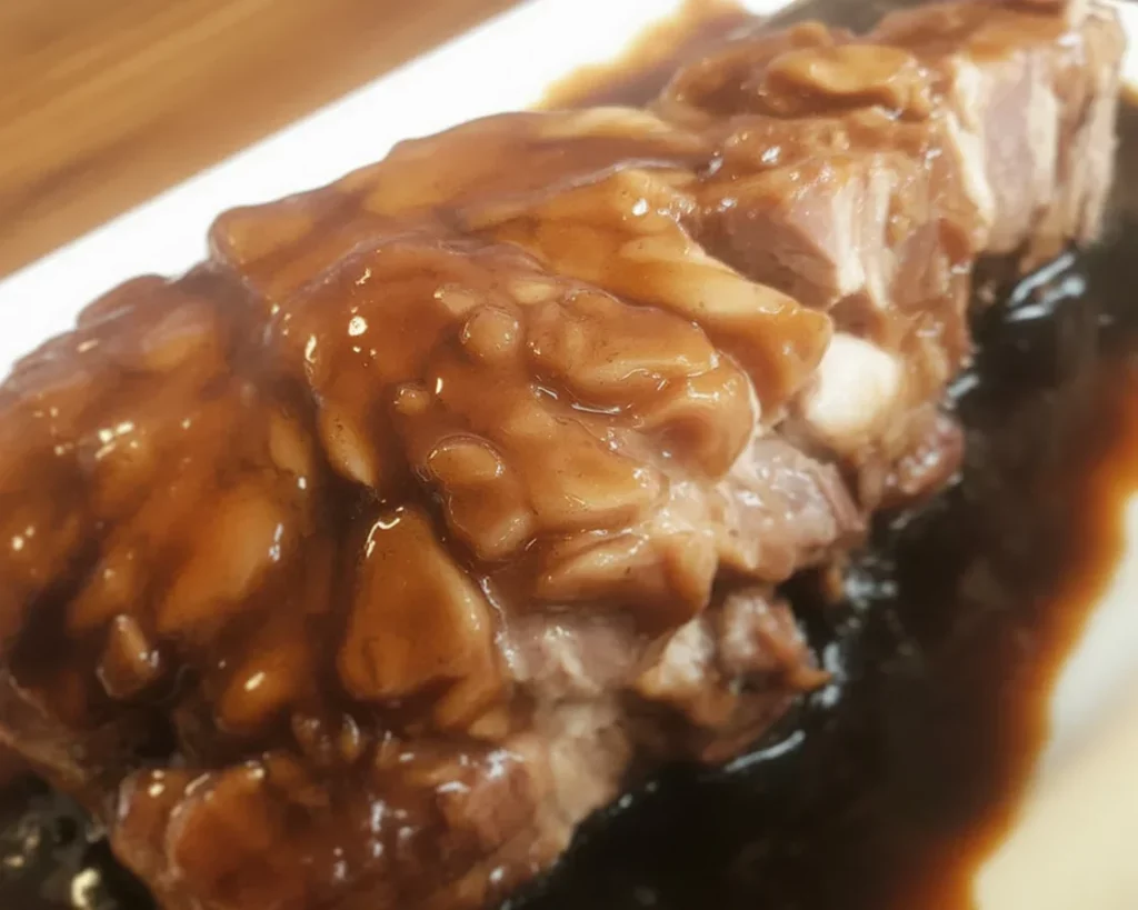 Delicious Filipino pork asado served with rice, a savory traditional dish.