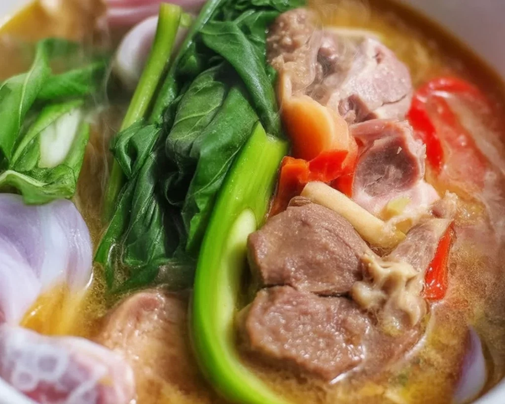 Bowl of sinigang, a traditional Filipino sour soup showcasing its cultural significance.