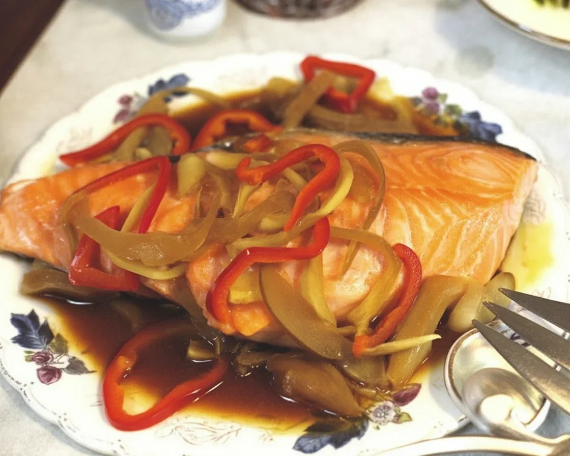 Delicious Filipino Crockpot Fish Escabeche with vibrant vegetables and vinegar sauce.