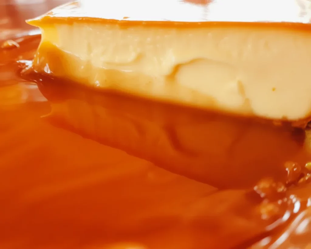 Filipino Crockpot Leche Flan Cheesecake with golden caramel topping