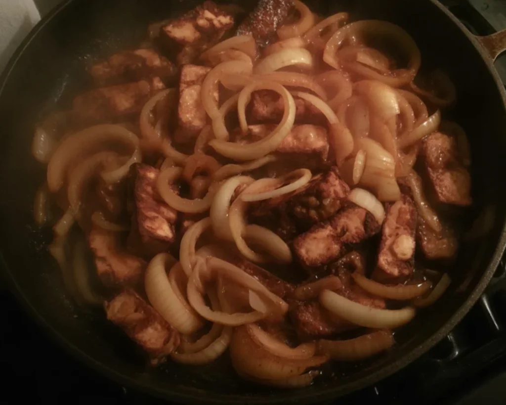 Delicious Filipino Crockpot Tofu Bistek served over rice with a rich sauce.