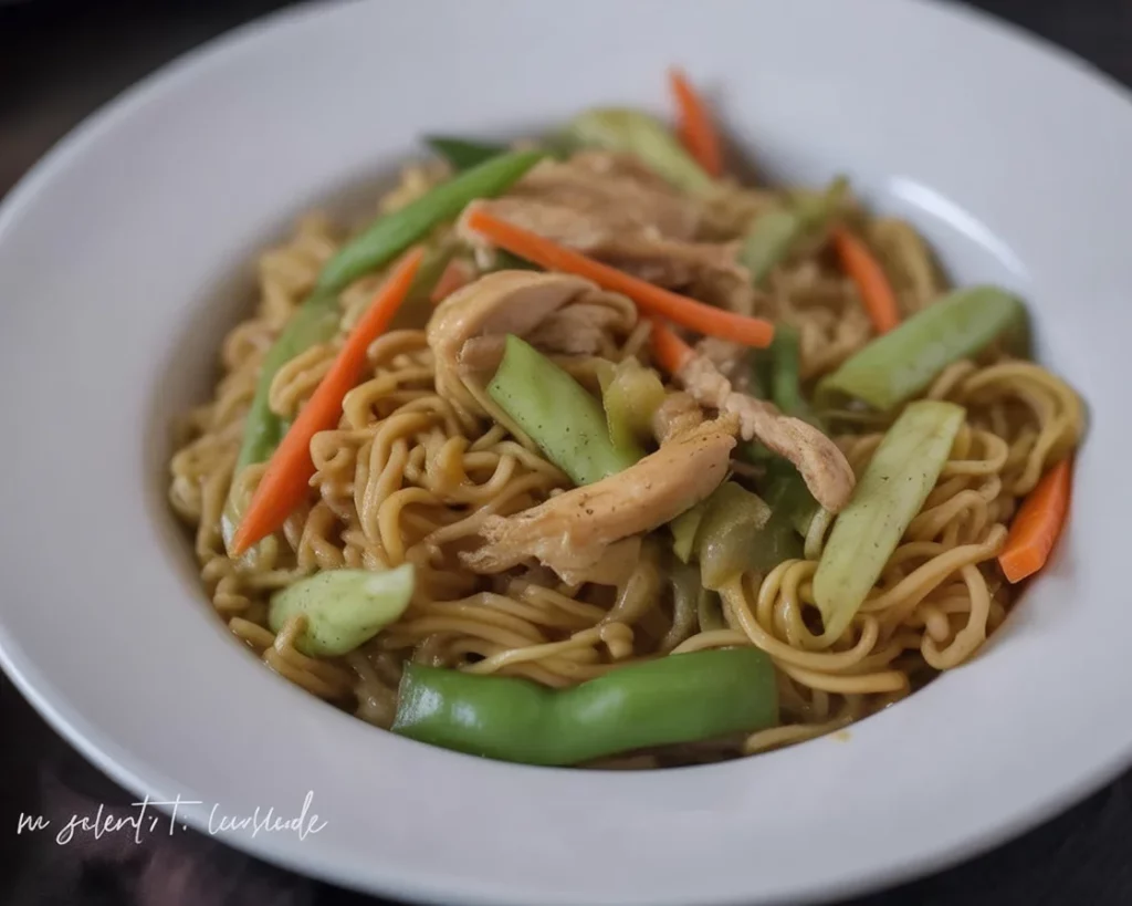 Delicious Pancit Canton served with fresh vegetables and savory sauce.