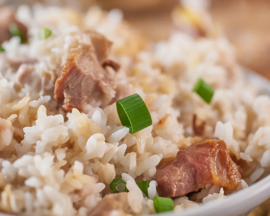 Plate of Adobo Fried Rice with eggs on woven placemat