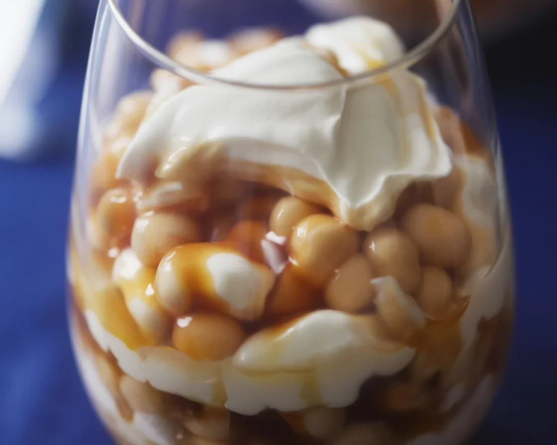 Taho Parfait with silken tofu, tapioca pearls, and brown sugar syrup served in a glass.