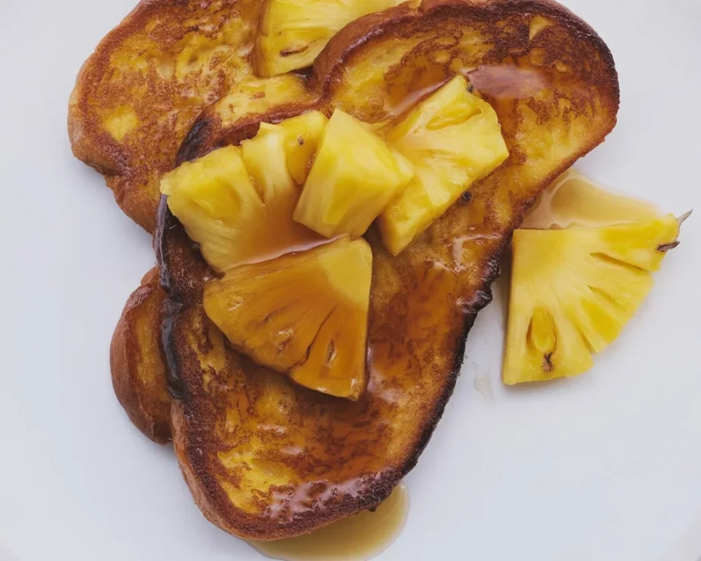Delicious Tropical French Toast with caramelized pineapple and coconut milk.