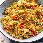 Healthy Filipino Chicken Salad with Calamansi Dressing served in a bowl.