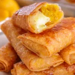 Mango Cream Cheese Lumpia dessert filled with sweet mango and creamy cheese, crispy golden brown.