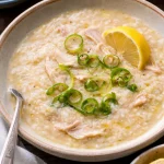 Bowl of easy Filipino ginger chicken soup with fresh ginger and vegetables