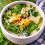 Bowl of easy Filipino vegetable coconut stew with vibrant seasonal vegetables.