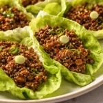 Filipino chicken lettuce wraps with fresh ingredients and vibrant flavors.