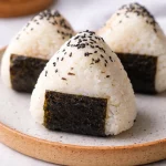 Filipino tuna rice balls onigiri recipe with tuna and mayonnaise wrapped in seaweed.