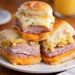 Delicious Pandesal Egg Breakfast Sliders with scrambled eggs and cheese in soft rolls.