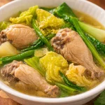 A bowl of Slow Cooker Chicken Tinola, a comforting Filipino chicken soup with ginger and vegetables.