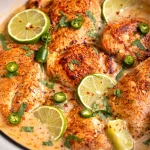 Filipino coconut lime chicken skillet with juicy chicken and creamy coconut milk