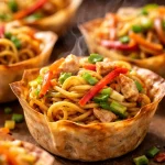 Delicious Baked Pancit Canton Cups You’ll Love Making! 5 Baked pancit canton cups with colorful vegetables and savory noodles